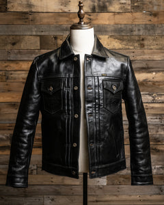 Front View of the Hardline Jacket: A front view of the Hardline Jacket by Master Supply Co., showcasing the premium vegetable-tanned cowhide leather with a rich patina and pleated front design.