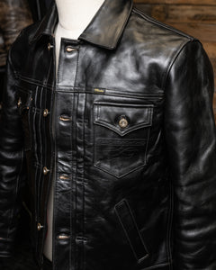 Front View of the Hardline Jacket: A front view of the Hardline Jacket by Master Supply Co., showcasing the premium vegetable-tanned cowhide leather with a rich patina and pleated front design.