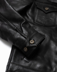Front View of the Hardline Jacket: A front view of the Hardline Jacket by Master Supply Co., showcasing the premium vegetable-tanned cowhide leather with a rich patina and pleated front design.